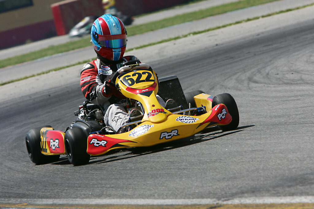 Yellow kart taking sharp left turn